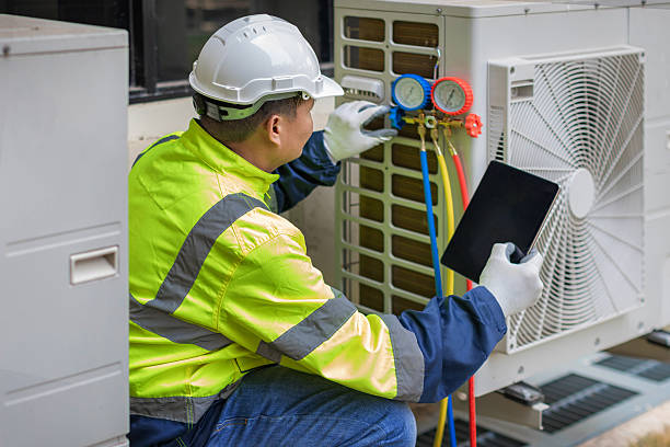 Professional Heat Pump Repair technician working in Manor, TX
